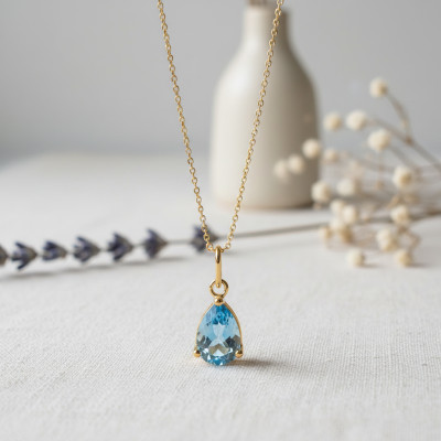 Pendentif goutte d'océan, Or jaune et Topaze bleue - Emanessence